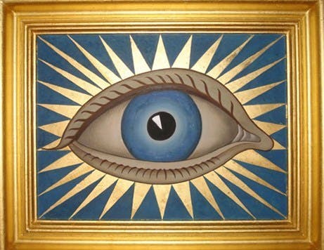 A stylised painting of a blue eye with a central black pupil, set against a blue background with radiating golden lines, framed in gold.